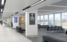 an empty airport terminal with chairs and signs on the walls that read gates 4 - 15