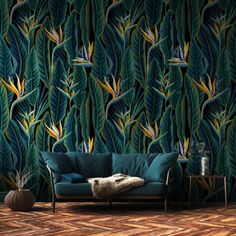 a living room scene with a couch and wallpaper that has green leaves on it