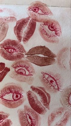 some pink and red lipstick on a white surface with lots of different types of lips