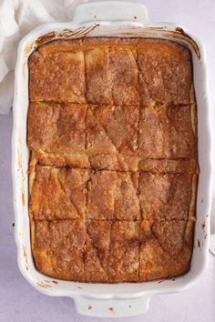 a square casserole dish filled with baked goods