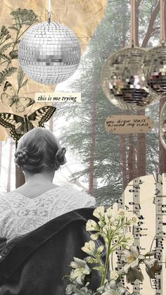 a woman looking at some disco balls hanging from the ceiling and flowers in front of her