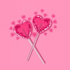 two lollipops in the shape of hearts on a pink background with hearts