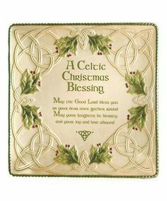 a celtic christmas blessing plaque with holly leaves and berries on the border, in white