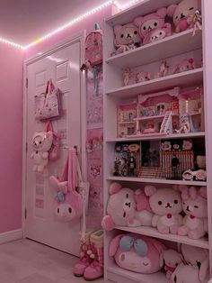 a room with pink walls and shelves filled with stuffed animals