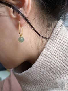 Earrings Nephrite Untreated Traditional stationery turned into the cutest pair of Pin drop earrings. An ideal pair to wear to the office, or Zoom meetings at home. Natural and untreated nephrite. Made by handwork of carving and polishing. Because of the gemstones natural characteristics, each piece may vary slightly in colors and textures. Weight: 4g/pair Metal: 14k gold-plated sterling silver, 8mm x 20mm Bead: nephrite, diameter 7mm Product care Avoid knocking against hard surfaces. Jade pieces are brittle and will break when hit with hard objects. Make sure that you take off your jewelry before you go swimming in a pool or hot tub. If youre handing dirt and soil, quartz dust in soil is abrasive to the stone. Avoid cleaning your jadeite with any acids or alcohol! It is suggested to only a Cool Dangly Earrings, Jade Accessories, Jade Jewellery, Wrist Candy, Jade Earrings, Jade Bracelet, Diamond Charm, Jade Jewelry, Dangly Earrings