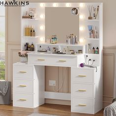 a white vanity with lights on it in a room