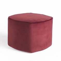 a small round ottoman with a deep red velvet finish and rounded foot rest, viewed from the front