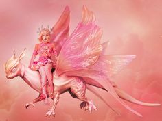 a woman riding on the back of a pink unicorn with wings flying above her head