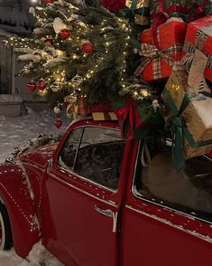 an old red car with presents on top