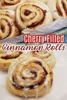 cinnamon rolls with icing on top and the words cherry filled cinnamon rolls below