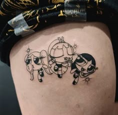 a woman's thigh with three cartoon characters on it