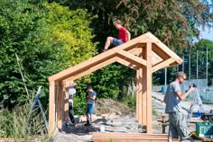 some people are working on a wooden structure