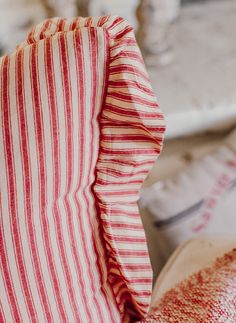 a red and white striped dish towel sitting on top of a table