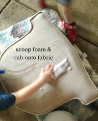 a young child is cleaning the floor with a sponge and cloth on top of it