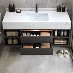 a bathroom with a sink and several pairs of slippers on the floor next to it