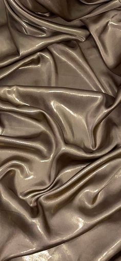 a close up view of a shiny silver fabric