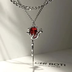 Description: Welcome to our collection of exquisite stainless steel jewelry, where elegance meets innovation. Behold our stunning Double Layer Rose Pendant Necklace, a true testament to beauty and craftsmanship. Crafted with precision and care, this necklace features a unique design with double layers of delicate rose pendants, each adorned with vibrant red zircon stones. The intricate detailing and irregular floral aesthetic make this piece a standout addition to any jewelry collection. The red zircon stones add a pop of color and sparkle, elevating the necklace to a new level of sophistication. Whether you're dressing up for a special occasion or adding a touch of glamour to your everyday look, this necklace is sure to turn heads and spark conversations. Designed to be versatile and time Egirl Necklace, Collar Rosa, Rose Pendant Necklace, Punk Earrings, Y2k Accessories, Crystal Heart Pendant, Beaded Tassel Necklace, Dark Rose, Kawaii Jewelry