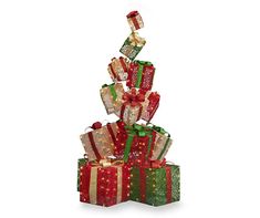 presents are stacked on top of each other with ribbons and bows around the gift boxes