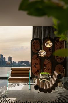 a living room filled with lots of furniture next to a large window covered in curtains