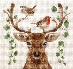 a cross stitch deer with birds on it's antlers