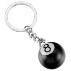 a keychain with a black ball and number eight on it's side