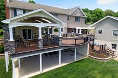 an aerial view of a home with patios and decking in the foreground