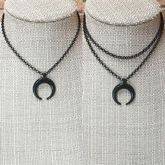 Shiny BLACK ENAMEL HORN Necklace * Single Necklace or Double Necklace * Double Crescent Necklace Black Crescent * All Black Necklace  Choose Single or Double Strand Single Necklace Lengths:  12",  14",  16",  18", or  20" - each comes with a 3" extender Double Necklace Lengths:  12",  13",  14",  or 15"  - each comes with a 3" extender Double necklace measurement is the shortest strand.  Longer strand will be about 1 1/4" longer. If you need a different size please contact us to create a custom order for you. MATERIALS: All components are plated.  Shiny black enamel chain has 3.8mm rolo links. Clasp, rings and extender chain are all shiny black plated.  Black metal double horn or crescent is 34x27mm **See pendants and chain closeup photos with a ruler to show the size. CARE:  Water and per Dark Chaotic Academia, Ashley Lane, Single Necklace, Double Necklace, Chaotic Academia, Crescent Necklace, Metal Family, Horn Necklace, Black Plates