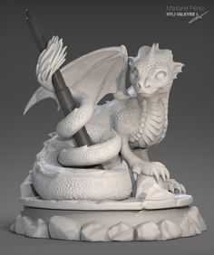 a white dragon figurine sitting on top of a rock formation with a pen in its mouth