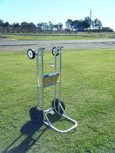 a small cart with two wheels in the grass