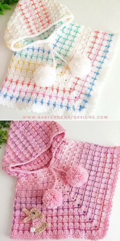 three crocheted baby sweaters with bows on them