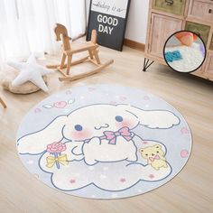 a child's room with wooden flooring, rocking chair and stuffed animals on the rug