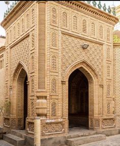 an intricately carved building with steps leading up to it