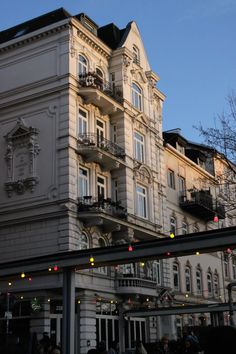 the building has many windows and balconies on it's sides as well