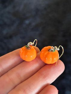 ❗️important ❗️ The mini pumpkin earrings are made out of polymer clay and glazed in UV resin. I make each one of these with love and care. I hope you love them just as much as I do :) all items are handmade. Each item will vary slightly from the last but this makes each one unique. All items are made to order. This means it'll take me about 1-2 weeks to ship them out. I will try to get them to you as soon as I can! Please note that to ensure quality, each item is glazed in UV resin- however they are still fragile objects so please handle with care🎃 Halloween Resin Jewelry Gift, Halloween Gift Resin Jewelry, Fun Orange Jewelry For Gifts, Fun Piercings, Fruity Aesthetic, Pumpkin Jewelry, Earrings Ideas, Earrings Fall, Earrings Halloween