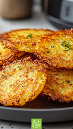 some fried potatoes are on a plate next to an instant pressure cooker