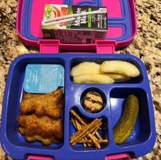 a lunch box with some food in it