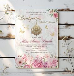 a pink and white floral bridal party card with chandelier in the middle