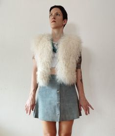 Rare fluffy 1970s leather shearling short vest in beautiful white color in excellent condition. The shearling fur is fluffy, soft and curly, just perfect. Great for autumn, winter and spring. The vest is worn open. Material: genuine leather and lamb/sheepskin MEASUREMENTS (taken flat): Armpit to armpit: 20.5'' (52 cm) Length: 19'' (48 cm) Condition: excellent vintage condition. There are no flaws and no fallout to the fur. visit the shop: http://www.etsy.com/shop/sherpavintage instagram | sherpa Leather Short, Short Vest, Vest Outfits, Leather Shorts, Fur Vest, Western Outfits, Fallout, Womens Vest, 1970s