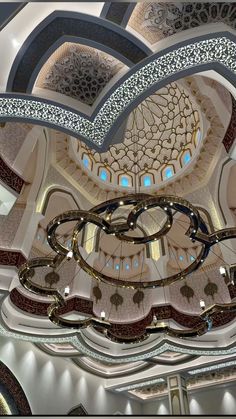 the inside of a large building with many circular designs on it's walls and ceiling