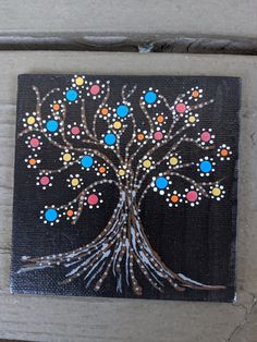 a painted tree on a black background