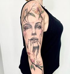 a woman with flowers on her arm and face