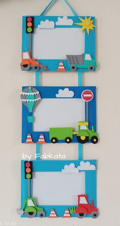 three frames are hanging on the wall with construction vehicles