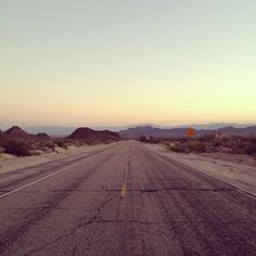 an empty road in the middle of nowhere