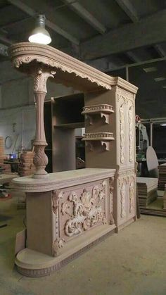 an ornately carved wooden counter in a shop