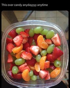 a plastic container filled with lots of fruit