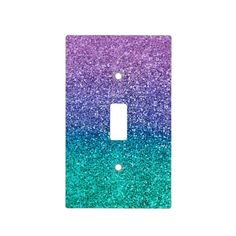 a light switch cover with purple and blue glitter