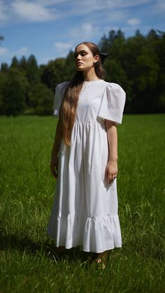 THE JANE DRESS www.krasnova.store Slightly oversized and airy dress with statement shaped cap sleeves and a ruffle midi hem. Tied with a bow at the back. ● White soft cotton poplin ● Fabric: 100% cotton ● The model is wearing size S ● Made to order in Prague ● If you are unsure about your size or need any other information please contact us. We are happy to help ❤️ White Billowy Puff Sleeve Dress With Gathered Sleeves, White Puff Sleeve Dress With Gathered Billowy Sleeves, White Voluminous Puff Sleeve Dress For Spring, Voluminous White Puff Sleeve Dress For Spring, Spring White Voluminous Puff Sleeve Dress, White Billowy Dress With Gathered Sleeves, White Dress With Puff Sleeves And Voluminous Skirt, White Voluminous Short Sleeve Dress, White Billowy Puff Sleeve Dress For Daywear