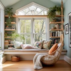 a window seat in front of a large window with bookshelves on either side