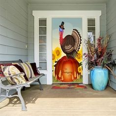 a door with a turkey on it and sunflowers in the back ground next to a bench