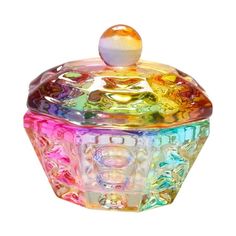 a multicolored glass cupcake container on a white background